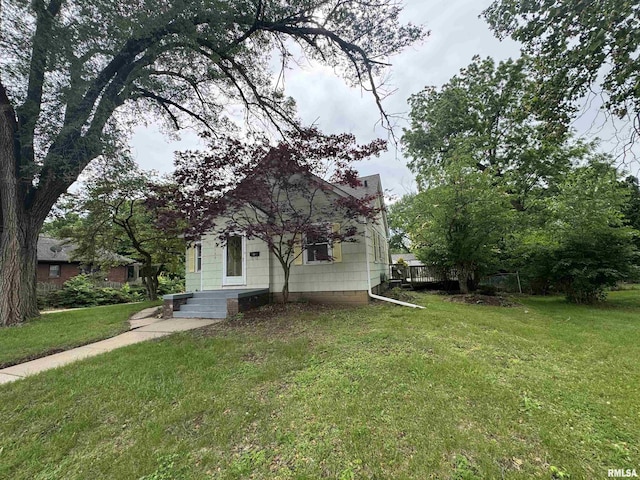 2139 10th St, East Moline, IL 61244 - view of home's exterior with a lawn