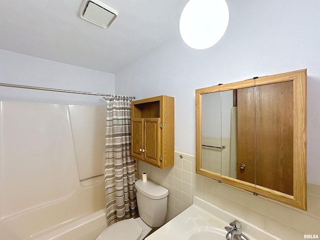 2347 W Lombard St, Davenport, IA 52804 - full bath with toilet, shower / bath combination with curtain, tile walls, and vanity