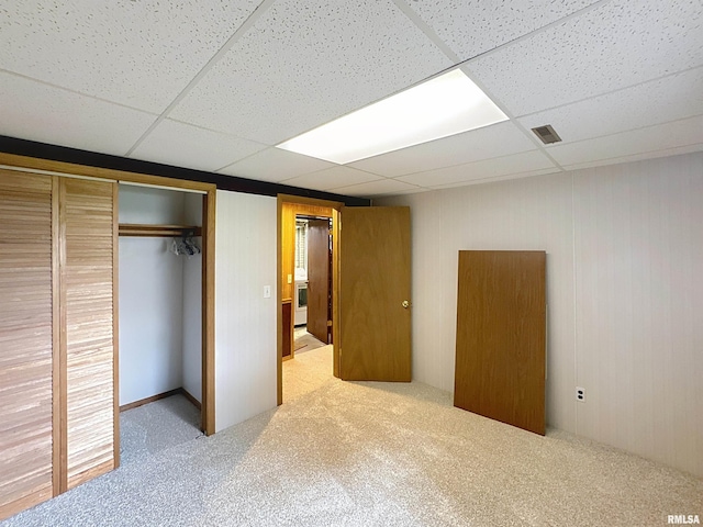 2347 W Lombard St, Davenport, IA 52804 - unfurnished bedroom featuring a paneled ceiling, carpet, and a closet