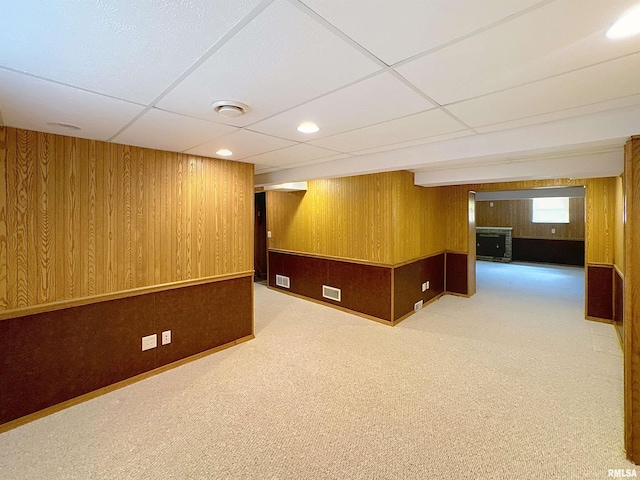 2347 W Lombard St, Davenport, IA 52804 - below grade area with wooden walls, a drop ceiling, and carpet