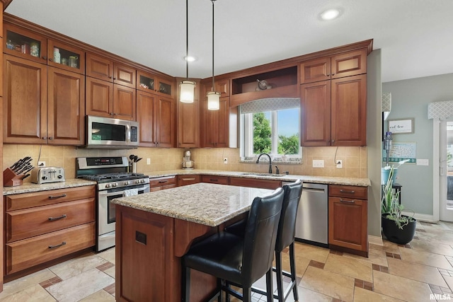 5518 Julie Ann Rd, Bettendorf, IA 52722 - kitchen with appliances with stainless steel finishes, backsplash, recessed lighting, baseboards, and glass insert cabinets