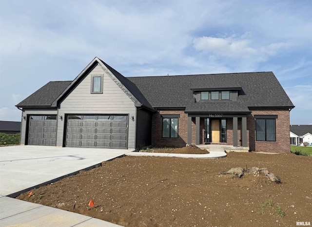 5167 Lakeside Ct, Bettendorf, IA 52722 - modern inspired farmhouse featuring brick siding, driveway, and a shingled roof