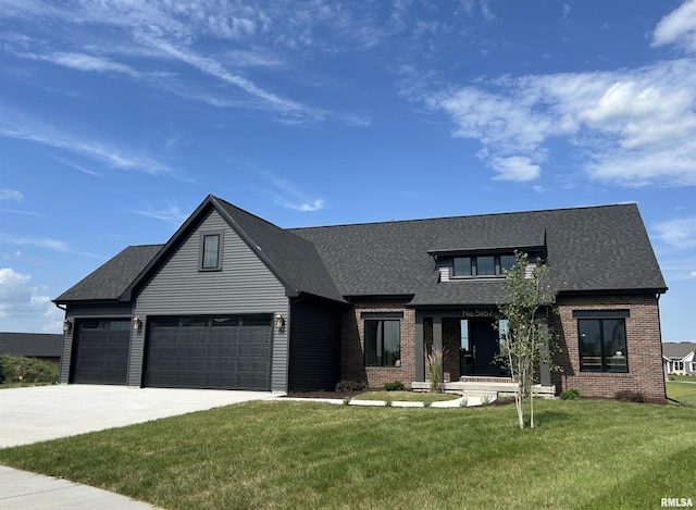 5167 Lakeside Ct, Bettendorf, IA 52722 - modern inspired farmhouse featuring brick siding, a front yard, driveway, a shingled roof, and an attached garage
