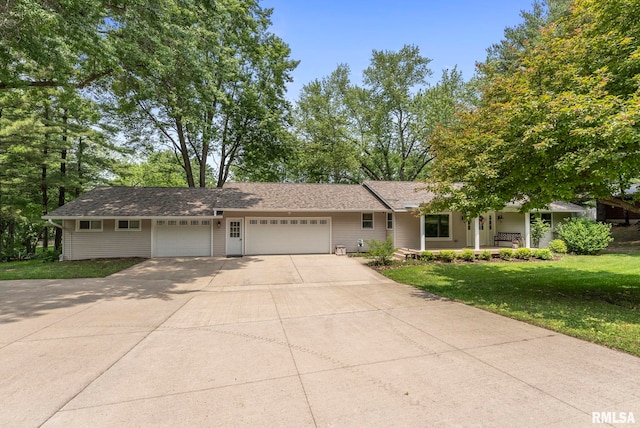 11 Shady Ln, Geneseo, IL 61254 - view of front of property with a garage, a front lawn, driveway, and a porch