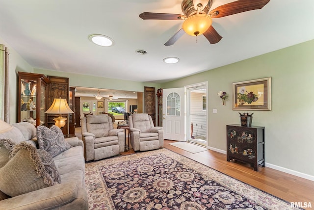 11 Shady Ln, Geneseo, IL 61254 - living area featuring wood finished floors, baseboards, and a ceiling fan