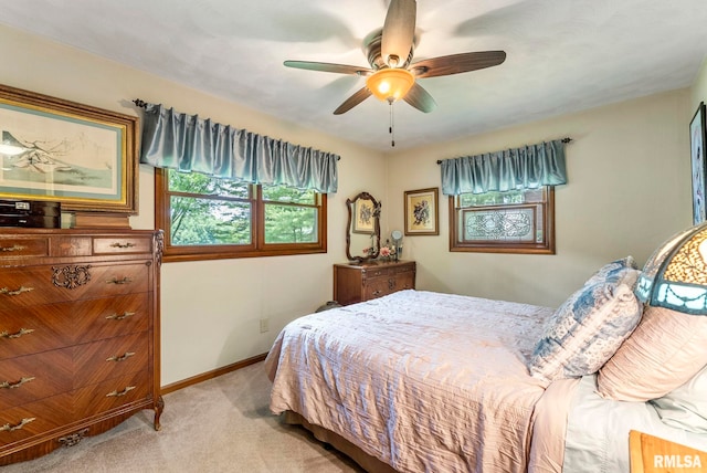 11 Shady Ln, Geneseo, IL 61254 - bedroom with light carpet, baseboards, and ceiling fan