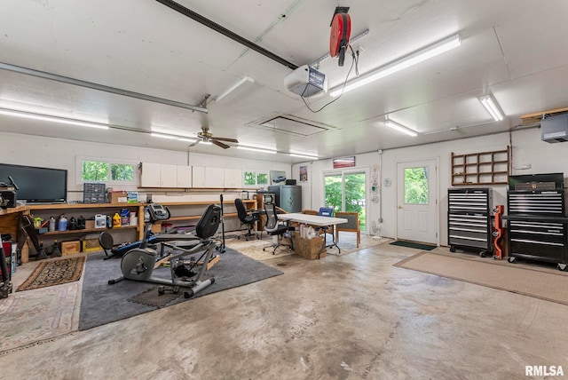 11 Shady Ln, Geneseo, IL 61254 - garage featuring a garage door opener and a workshop area