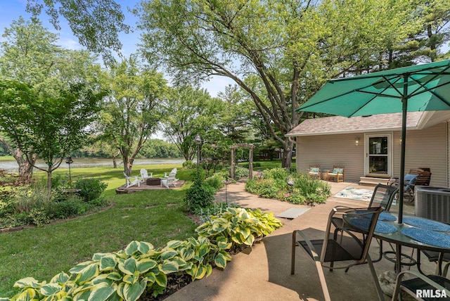 11 Shady Ln, Geneseo, IL 61254 - view of patio featuring an outdoor fire pit and central AC