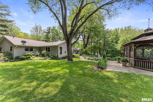 11 Shady Ln, Geneseo, IL 61254 - view of green lawn with a gazebo and a patio