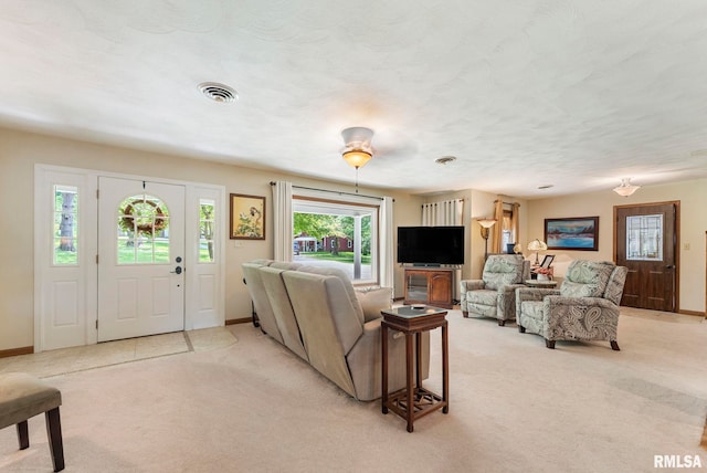 11 Shady Ln, Geneseo, IL 61254 - living room with light carpet, healthy amount of natural light, and baseboards