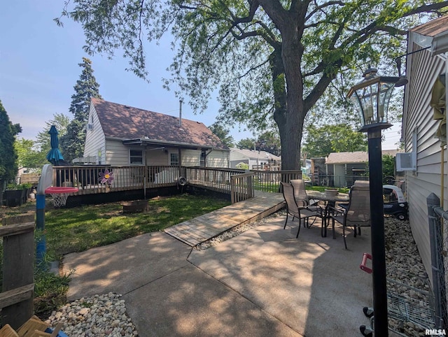 1519 W Columbia Ave, Davenport, IA 52804 - view of patio featuring outdoor dining space and a deck