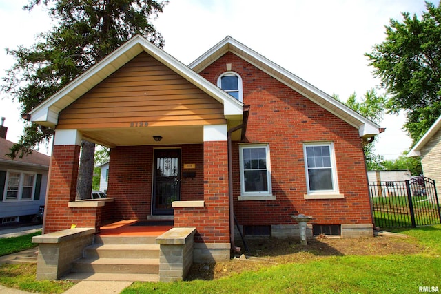 2128 Bellevue Ave, Bettendorf, IA 52722 - bungalow-style house with brick siding and a porch