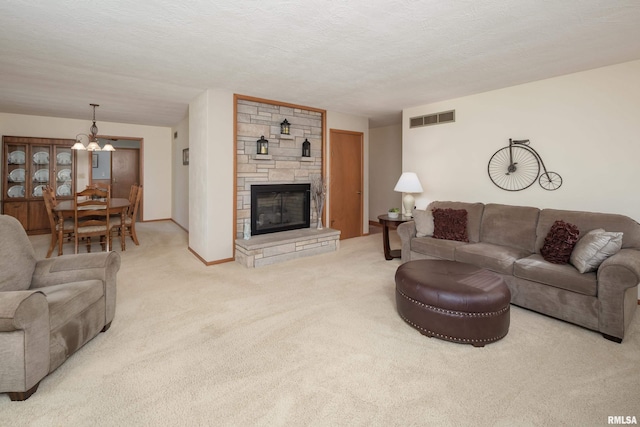 2737 28th Ave, Rock Island, IL 61201 - carpeted living room with a fireplace, a chandelier, and baseboards
