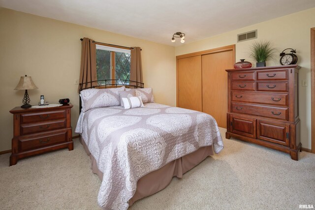 2737 28th Ave, Rock Island, IL 61201 - bedroom with light colored carpet, a closet, and baseboards