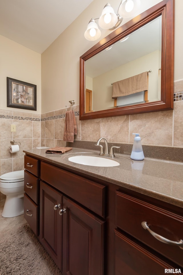 2737 28th Ave, Rock Island, IL 61201 - bathroom with vanity, tile walls, and toilet