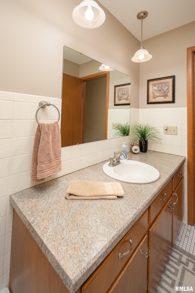 2737 28th Ave, Rock Island, IL 61201 - bathroom with tile walls, vanity, and a wainscoted wall