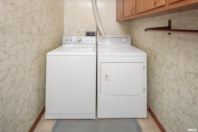 2737 28th Ave, Rock Island, IL 61201 - laundry room with independent washer and dryer, light tile patterned floors, cabinet space, and baseboards