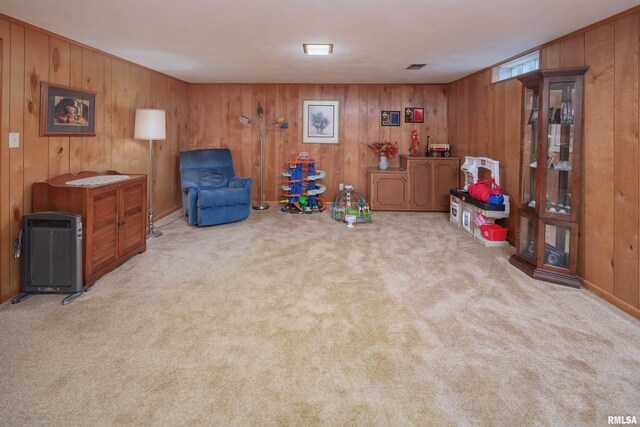 2737 28th Ave, Rock Island, IL 61201 - living area with carpet flooring and wood walls