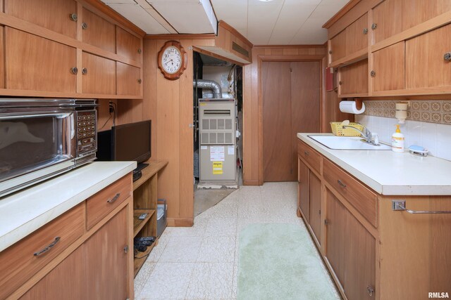 2737 28th Ave, Rock Island, IL 61201 - kitchen with a sink, black microwave, light countertops, and tasteful backsplash