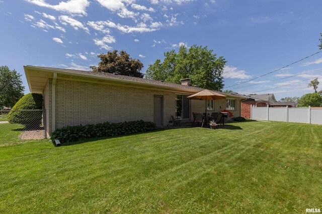 2737 28th Ave, Rock Island, IL 61201 - back of property featuring brick siding and a chimney