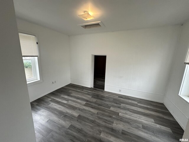 431 N 5th St, Quincy, IL 62301 - spare room with dark wood-type flooring, attic access, and baseboards