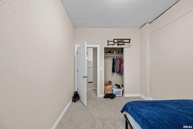 2734 Bridge Ave, Davenport, IA 52803 - carpeted bedroom with a textured ceiling and baseboards