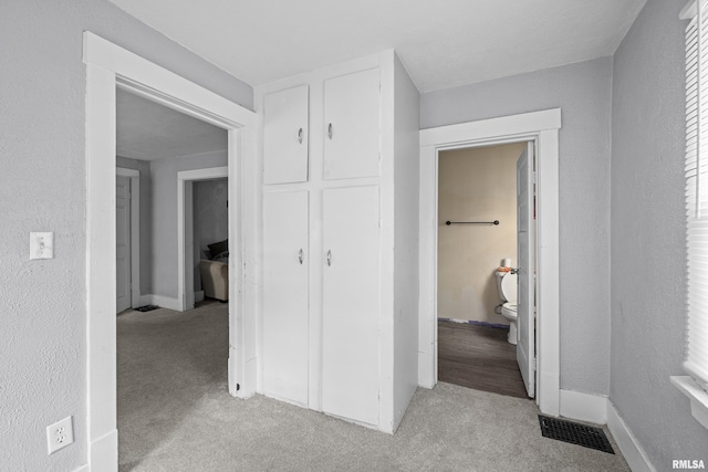 2734 Bridge Ave, Davenport, IA 52803 - corridor with light colored carpet and baseboards
