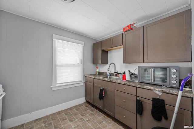 2734 Bridge Ave, Davenport, IA 52803 - kitchen featuring a sink and baseboards