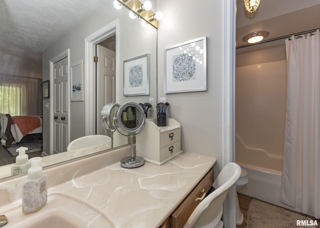 726 51st Ave Unit 20, East Moline, IL 61244 - ensuite bathroom featuring shower / tub combo, vanity, wood finished floors, a textured ceiling, and toilet