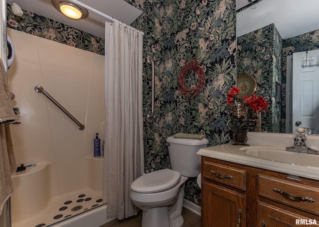 726 51st Ave Unit 20, East Moline, IL 61244 - bathroom featuring wallpapered walls, vanity, toilet, a shower stall, and wood finished floors