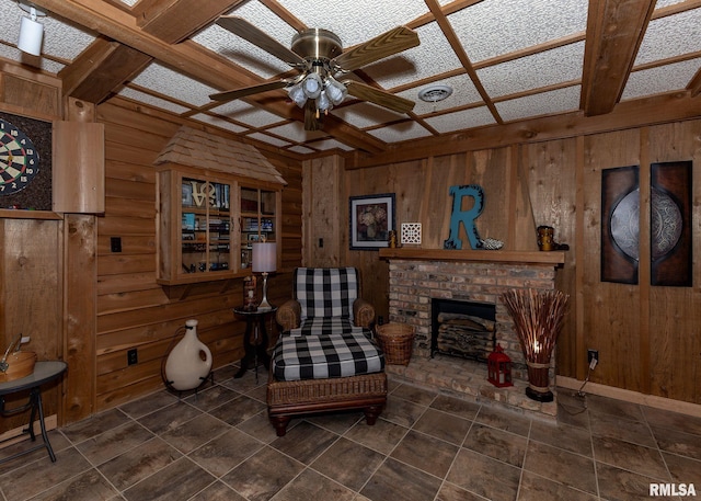 726 51st Ave Unit 20, East Moline, IL 61244 - living area with ceiling fan, wood walls, a brick fireplace, and coffered ceiling