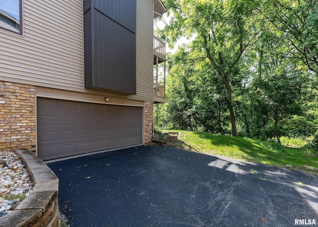 726 51st Ave Unit 20, East Moline, IL 61244 - garage featuring asphalt driveway