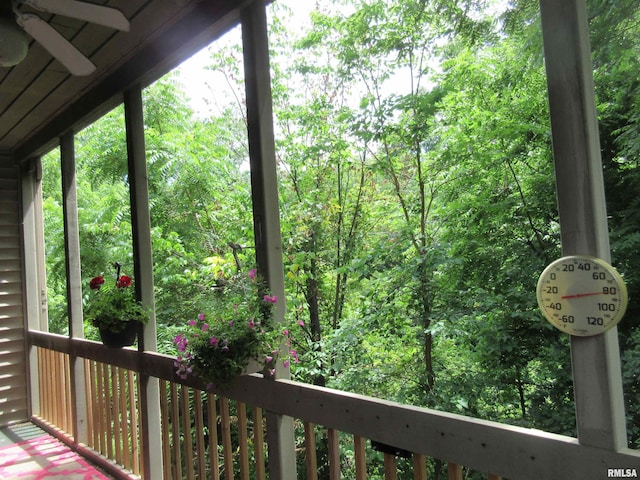 726 51st Ave Unit 20, East Moline, IL 61244 - deck with a ceiling fan and a wooded view