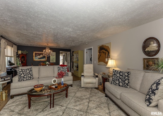 726 51st Ave Unit 20, East Moline, IL 61244 - living area featuring a chandelier, a textured ceiling, and wood finished floors