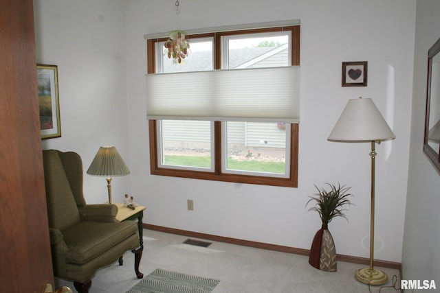 3996 Partridge Cir, Bettendorf, IA 52722 - sitting room with carpet, plenty of natural light, and baseboards
