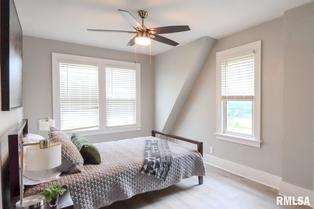 1617 Payson Ave, Quincy, IL 62301 - bedroom with wood finished floors, baseboards, and ceiling fan