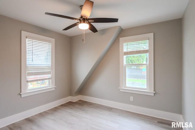 1617 Payson Ave, Quincy, IL 62301 - empty room featuring baseboards, a ceiling fan, and wood finished floors