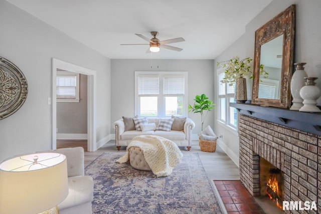 1617 Payson Ave, Quincy, IL 62301 - living area with healthy amount of natural light, a ceiling fan, a fireplace, and baseboards
