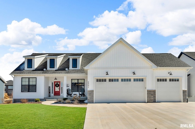 6997 Matthews Pass, Bettendorf, IA 52722 - modern farmhouse featuring a garage, covered porch, and concrete driveway