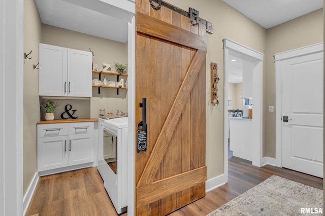 6997 Matthews Pass, Bettendorf, IA 52722 - storage area with washing machine and clothes dryer