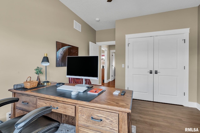6997 Matthews Pass, Bettendorf, IA 52722 - office space featuring dark wood-style flooring, baseboards, and a ceiling fan