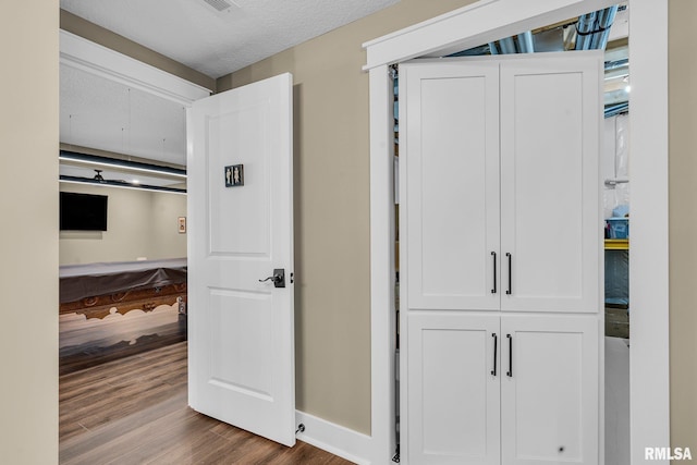 6997 Matthews Pass, Bettendorf, IA 52722 - hall with wood finished floors and baseboards