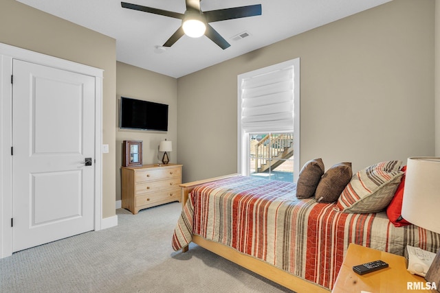 6997 Matthews Pass, Bettendorf, IA 52722 - bedroom with light carpet, baseboards, and a ceiling fan