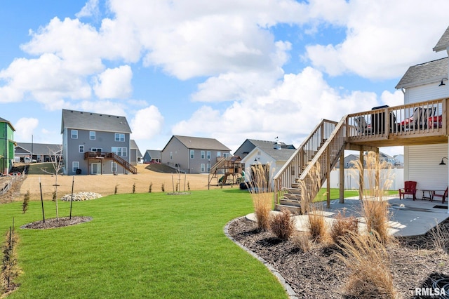 6997 Matthews Pass, Bettendorf, IA 52722 - view of yard with stairs, a patio, a residential view, and a deck