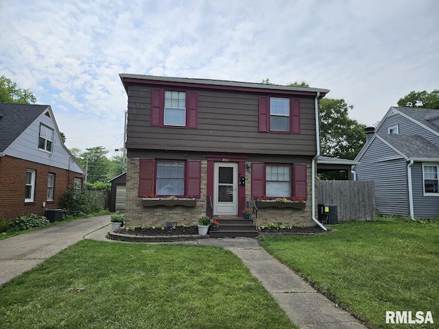 2336 24 1/2 St, Rock Island, IL 61201 - colonial-style house with entry steps and cooling unit