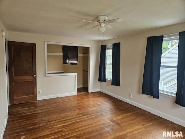2336 24 1/2 St, Rock Island, IL 61201 - unfurnished room featuring a ceiling fan, wood finished floors, and baseboards