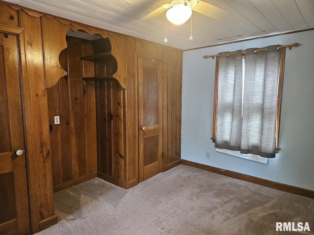 2336 24 1/2 St, Rock Island, IL 61201 - bedroom with wood walls, carpet floors, and baseboards
