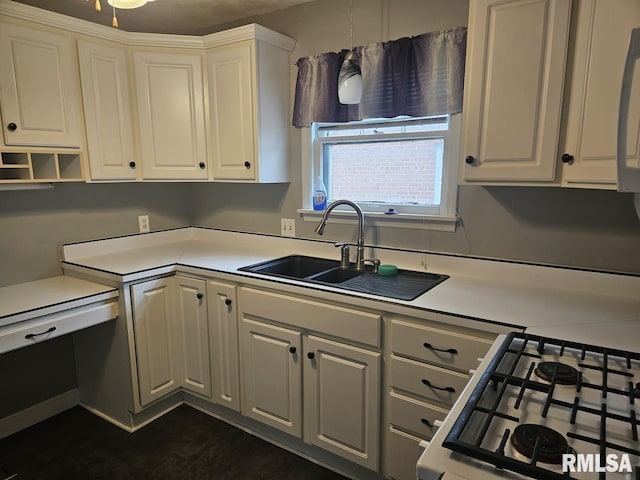 2336 24 1/2 St, Rock Island, IL 61201 - kitchen with a sink, white cabinetry, range with gas stovetop, and light countertops