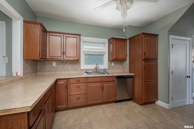 1637 24th Ave, Moline, IL 61265 - kitchen with dishwasher, a sink, decorative backsplash, a ceiling fan, and light countertops