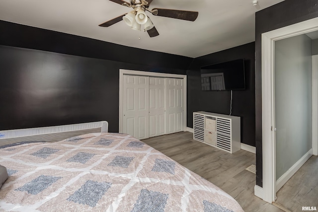 1637 24th Ave, Moline, IL 61265 - bedroom with wood finished floors, ceiling fan, baseboards, and a closet